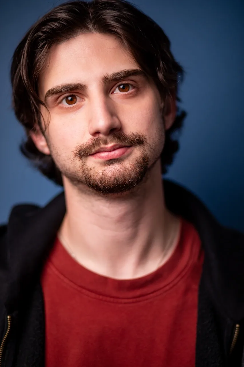 Headshot, blue background