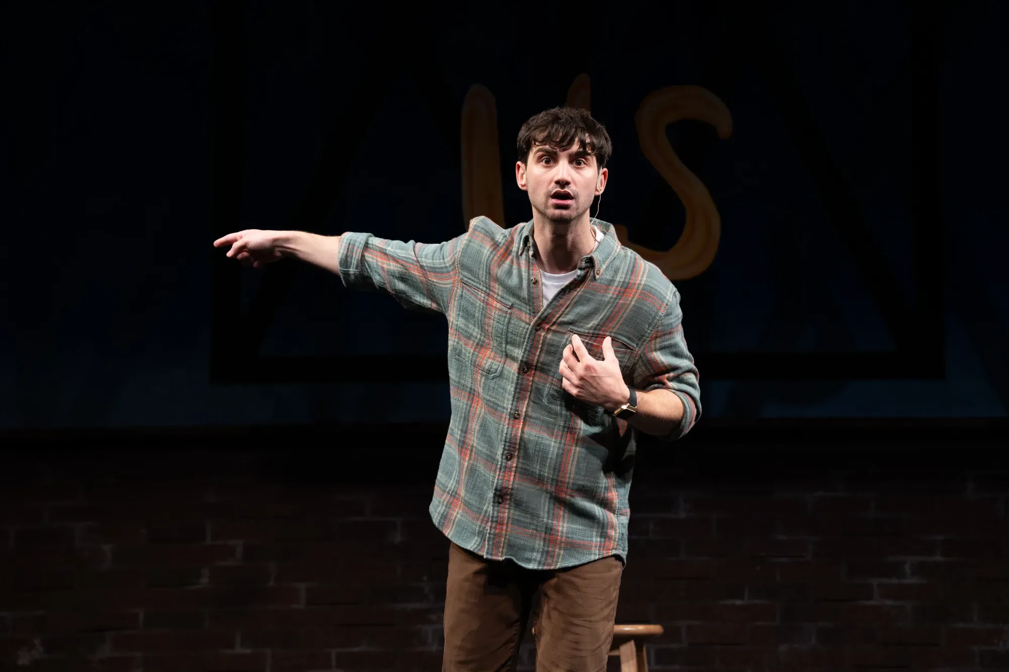 Jacob as Alex in Just for Us, pointing out toward the audience