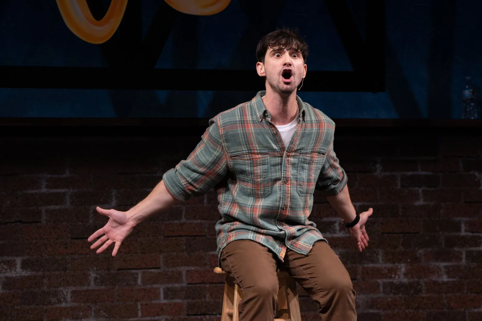 Jacob on a stool, arms out, mid-line